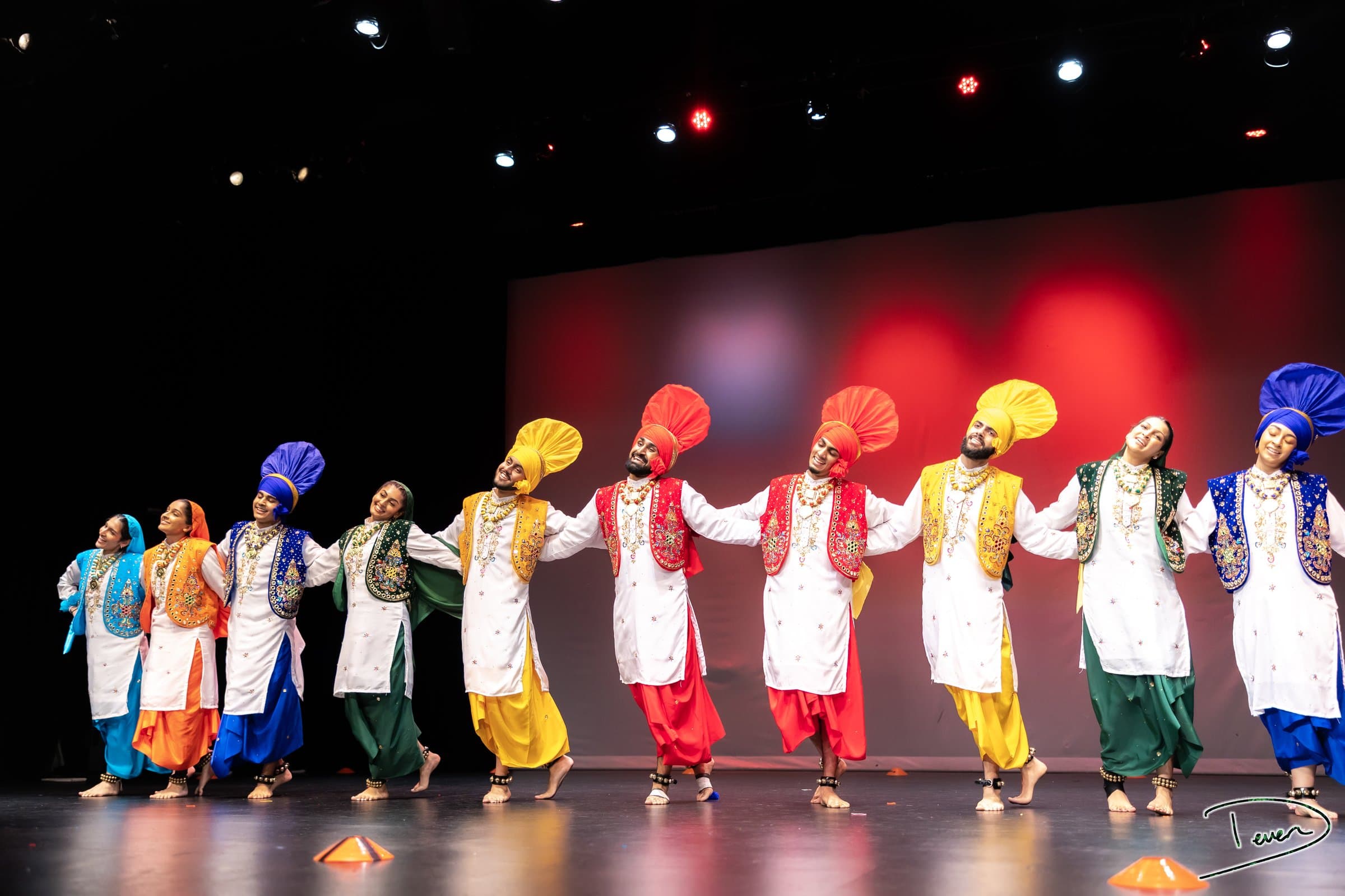 A Bhangra team performing on stage